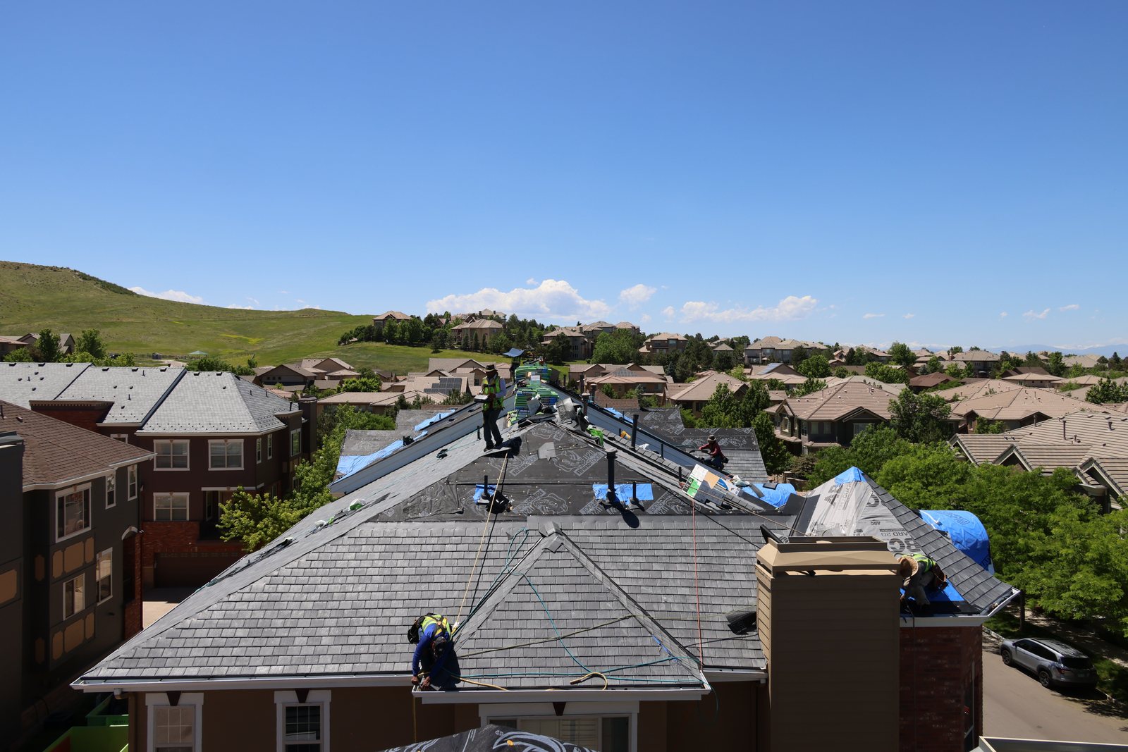 Fixins crew re-roofing a Colorado Springs neighborhood home