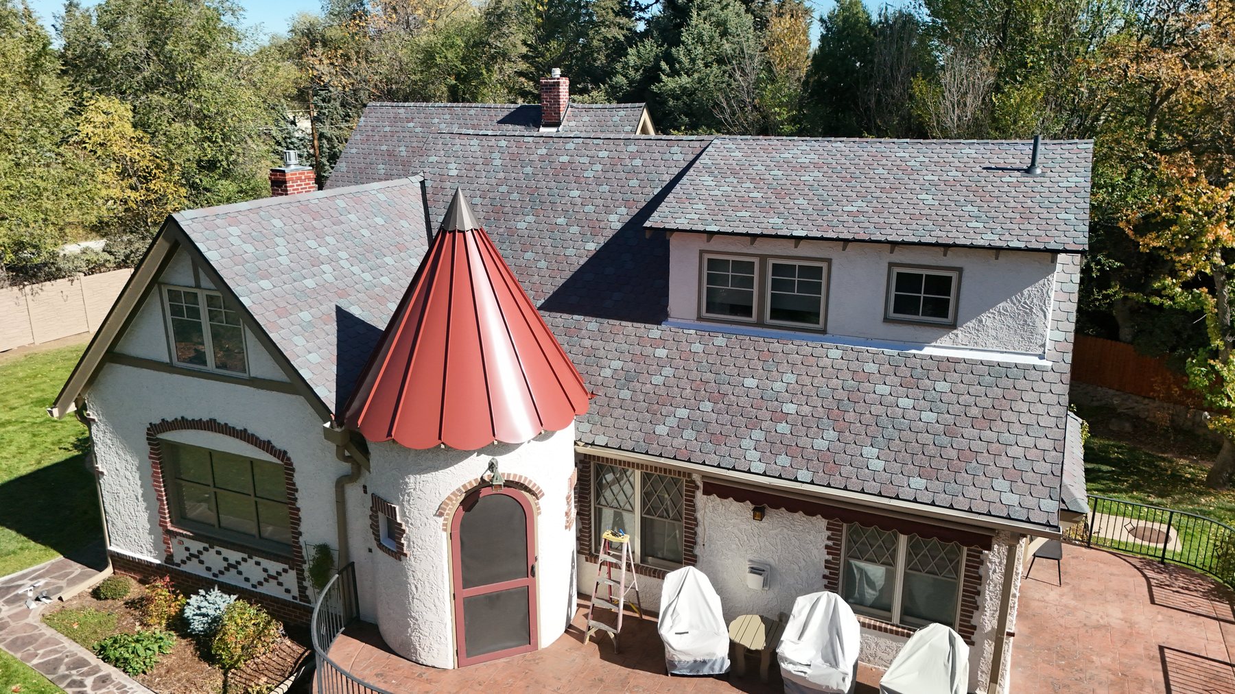 F-Wave REVIA synthetic slate roof with copper turret on a Colorado Springs home by Fixins