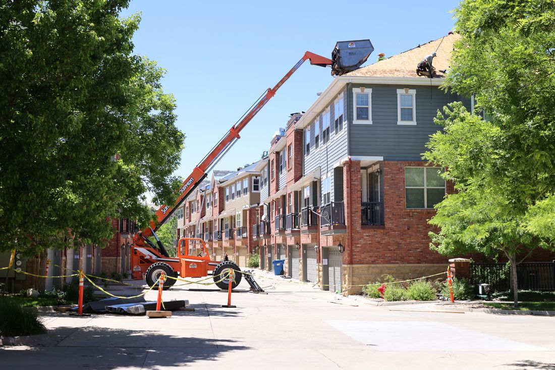 Fixins commercial roofing crew working on Colorado Springs business property